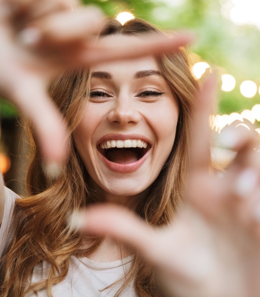 Woman showing off her smile makeover