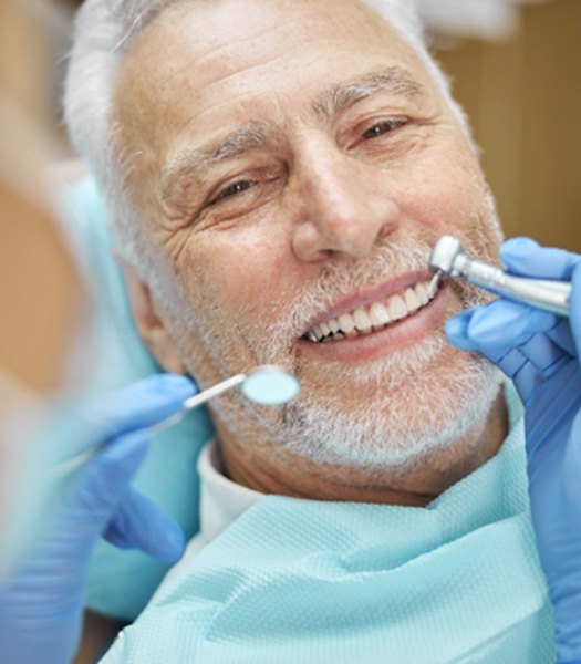 Man smiling with dental crown in Los Angeles 