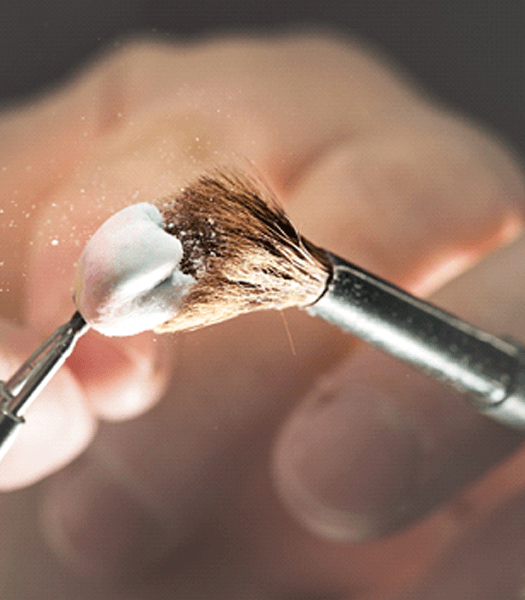 A close-up of a brushed dental crown