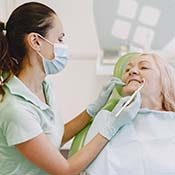 Implant dentist in Rancho Park performing a dental exam