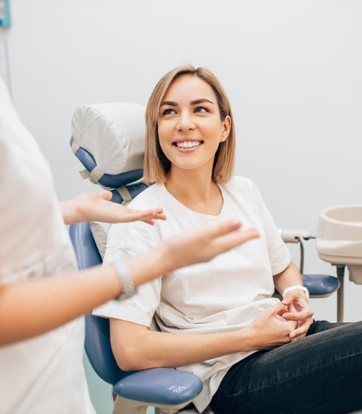 Woman talking to dentist about what her dental insurance plan covers