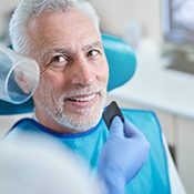 Close-up of smiling male dental patient about to receive X-ray