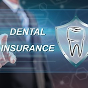 Graphic with words “Dental Insurance” with picture of shield with a tooth on it
