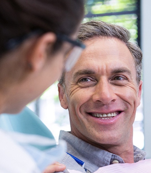 man talking to his implant dentist in Rancho Park 