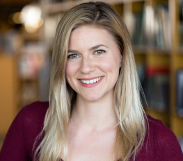 Smiling blonde woman in red blouse