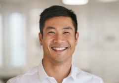 Young man in white shirt smiling