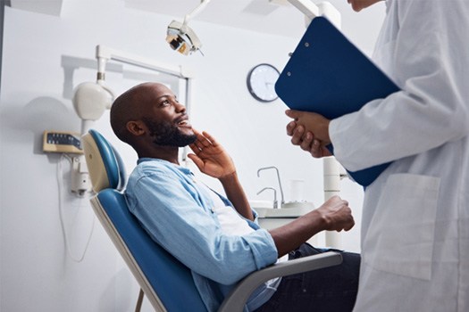 Man smiling at the dentist