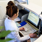 Receptionist working at a desk