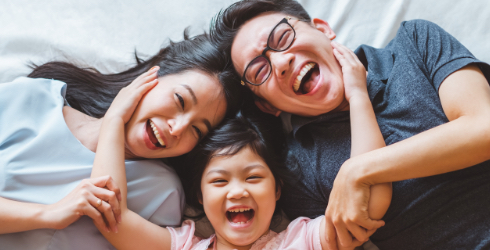 Family laughing together after preventive dentistry