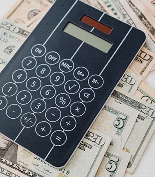 Calculator and cash on table
