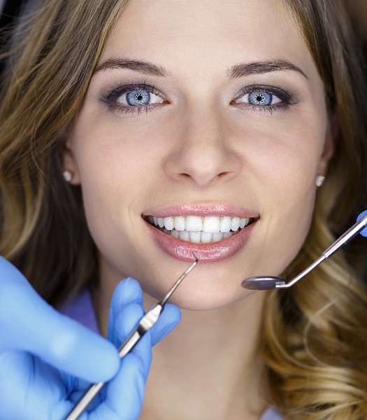 a patient visiting their cosmetic dentist in Los Angeles