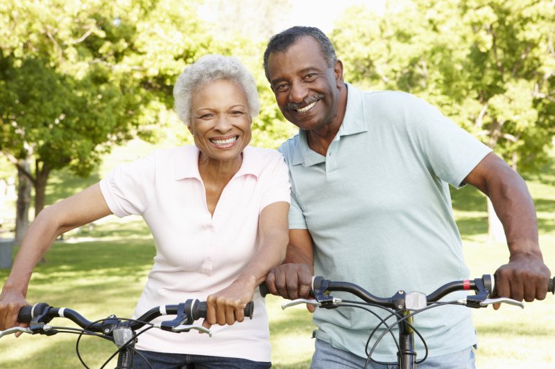 Couple smiling with dental implants