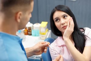 Woman at the dentist for an emergency dental visit.