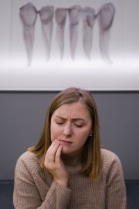 Woman in pain at emergency dentist