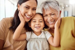 three generations of a family smiling together